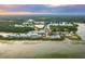 Aerial view of the a neighborhood near a lake at 3023 Eventide Dr, Johns Island, SC 29455