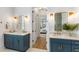 Elegant bathroom with double vanities, modern fixtures, and a view into the main bedroom at 3023 Eventide Dr, Johns Island, SC 29455