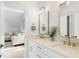 Bathroom with double vanity, white cabinets, and gold fixtures that opens to a living area at 3023 Eventide Dr, Johns Island, SC 29455