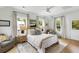 Bright bedroom with hardwood floors, a ceiling fan, and natural light at 3023 Eventide Dr, Johns Island, SC 29455