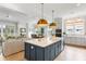 Spacious kitchen with open floorplan, large island, and a seamless connection to the living area at 3023 Eventide Dr, Johns Island, SC 29455