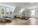 Spacious living room with many windows, wood floors, a comfortable sofa, and neutral decor at 3023 Eventide Dr, Johns Island, SC 29455
