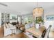 Open-concept living space featuring a chandelier, fireplace, and golf course views at 3023 Eventide Dr, Johns Island, SC 29455