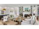 Bright living room with custom built-ins, fireplace, and comfortable seating arrangement at 3023 Eventide Dr, Johns Island, SC 29455
