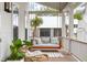 Charming porch featuring a cozy swing, stylish seating, and natural light streaming through at 3023 Eventide Dr, Johns Island, SC 29455