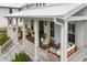 Charming porch featuring a cozy swing, stylish seating, and natural light streaming through at 3023 Eventide Dr, Johns Island, SC 29455