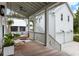 Charming porch featuring a cozy swing, stylish seating, and natural light streaming through at 3023 Eventide Dr, Johns Island, SC 29455