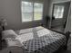 Comfortable bedroom with bright lighting, a mirrored closet, and a neutral palette at 304 Carolina Cir, Walterboro, SC 29488