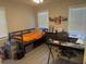 Bedroom featuring a bed, a desk, two windows, and decor at 304 Carolina Cir, Walterboro, SC 29488
