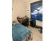 Bedroom with a blue comforter on the bed, a desk, and decorations related to race cars at 304 Carolina Cir, Walterboro, SC 29488