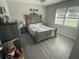 Cozy bedroom with natural light, hardwood floors, and neutral decor at 304 Carolina Cir, Walterboro, SC 29488