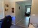 Hallway with grey walls leading into a living room, decorated with various pictures and a car-themed theme at 304 Carolina Cir, Walterboro, SC 29488