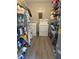 Laundry room featuring shelving, laundry machines, and cleaning supplies at 304 Carolina Cir, Walterboro, SC 29488