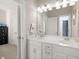 Bright bathroom with dual sinks and access to shower/toilet room at 308 Oak Park St, Summerville, SC 29486