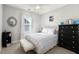 Cozy bedroom with window, and dark wood dresser and nightstand at 308 Oak Park St, Summerville, SC 29486