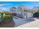 Exterior of the house featuring a garage, driveway, and partial landscaping at 308 Oak Park St, Summerville, SC 29486