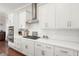 Spacious kitchen featuring white cabinets, stainless steel appliances and white subway tile backsplash at 308 Oak Park St, Summerville, SC 29486