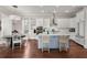 Modern kitchen with white cabinetry, a center island, and stainless steel appliances, ideal for cooking at 308 Oak Park St, Summerville, SC 29486