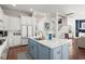 Kitchen boasts white and blue cabinets, marble countertops and stainless steel appliances at 308 Oak Park St, Summerville, SC 29486