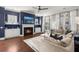 Cozy living room with a fireplace, built-in cabinets, and plush seating, ideal for relaxing evenings at 308 Oak Park St, Summerville, SC 29486