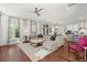 Bright and spacious living room featuring hardwood floors, large windows, and a comfortable seating area at 308 Oak Park St, Summerville, SC 29486
