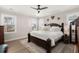 Bright main bedroom with hardwood floors, ceiling fan, and accent rug at 308 Oak Park St, Summerville, SC 29486