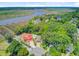 A high angle shows how the house sits nestled among trees and close to the river at 310 Christiee Ct, North Charleston, SC 29418