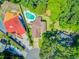 Aerial view of a home showcasing the pool, lush landscaping, and private outdoor living spaces at 310 Christiee Ct, North Charleston, SC 29418