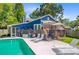Exterior backyard of a home showcasing a lovely pool, deck, and lounge chairs for outdoor living at 310 Christiee Ct, North Charleston, SC 29418
