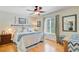 Bedroom with hardwood floors, a ceiling fan, and large windows providing natural light at 310 Christiee Ct, North Charleston, SC 29418