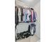 Organized closet space with hanging rods, shelves, and shoe racks for storage and organization at 310 Christiee Ct, North Charleston, SC 29418