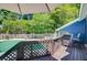 Deck with lounge area overlooking the pool and backyard, perfect for outdoor entertaining and relaxation at 310 Christiee Ct, North Charleston, SC 29418