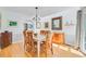 Traditional dining room with wood table, chandelier, and hardwood floors at 310 Christiee Ct, North Charleston, SC 29418