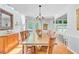 Elegant dining room with hardwood floors, natural light, and modern decor at 310 Christiee Ct, North Charleston, SC 29418
