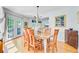 Bright dining room with wood table, chandelier, and French doors at 310 Christiee Ct, North Charleston, SC 29418