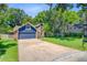 Attractive home with an attached garage, a lush green lawn, and well-maintained landscaping at 310 Christiee Ct, North Charleston, SC 29418