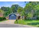 Inviting home with a manicured lawn, mature trees, and a classic mailbox at 310 Christiee Ct, North Charleston, SC 29418