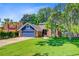 Charming two-story home features a two-car garage and a well-manicured lawn with mature trees at 310 Christiee Ct, North Charleston, SC 29418