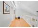 Bright hallway features hardwood floors, white walls, and a vaulted ceiling with natural light at 310 Christiee Ct, North Charleston, SC 29418