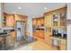Bright kitchen featuring wood cabinetry, granite countertops, and stainless steel appliances at 310 Christiee Ct, North Charleston, SC 29418