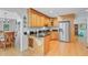 Updated kitchen with stainless steel appliances, wooden cabinets, and granite countertops at 310 Christiee Ct, North Charleston, SC 29418