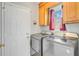 Well-equipped laundry room with modern washer and dryer, convenient access, and ample natural light at 310 Christiee Ct, North Charleston, SC 29418