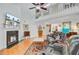 Spacious living room with a fireplace, hardwood floors, and a statement rug at 310 Christiee Ct, North Charleston, SC 29418