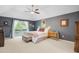 Large main bedroom offers vaulted ceiling and a sliding door to a private balcony at 310 Christiee Ct, North Charleston, SC 29418