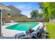 Private backyard pool with inviting lounge chairs and a cozy seating area at 310 Christiee Ct, North Charleston, SC 29418