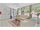 Cozy sunroom with neutral furniture, tiled floors, and views of the outdoor area at 310 Christiee Ct, North Charleston, SC 29418