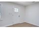 Bright entryway with white trim, light walls, and wood-look flooring at 3231 Stonehaven Dr, North Charleston, SC 29420