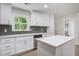 Well-lit kitchen with white cabinets, stainless steel appliances, and a garden window at 3231 Stonehaven Dr, North Charleston, SC 29420