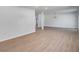 Open concept living room features wood-look flooring, white trim, and recessed lighting at 3231 Stonehaven Dr, North Charleston, SC 29420