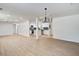 Bright living room featuring an open floor plan that flows into the kitchen at 3231 Stonehaven Dr, North Charleston, SC 29420